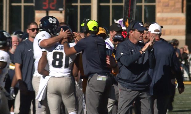 Utah State wide receiver Savon Scarver celebrates on the side line against Wyoming in Laramie....