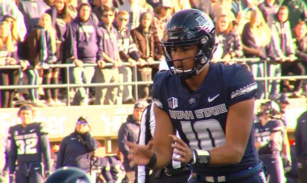 Jordan Love receives a snap in the Aggies' win over San Jose State. (Matt Glade, KSL Sports)...