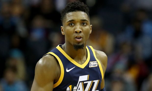 Donovan Mitchell #45 of the Utah Jazz reacts after a play against the Charlotte Hornets during thei...