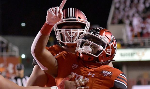 Armand Shyne #6 of the Utah Utes celebrates his winning touchdown in the second half of a game at R...