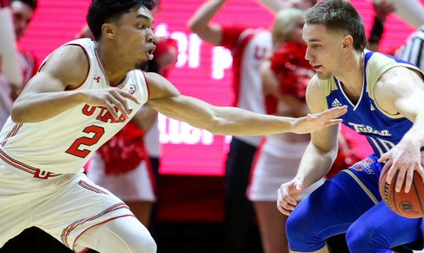 Utah Utes guard Sedrick Barefield (2) lunges for the ball against Tulsa Golden Hurricane guard Curr...