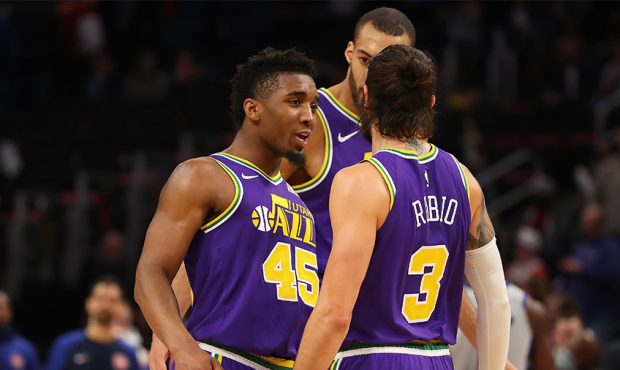 Donovan Mitchell #45 of the Utah Jazz celebrates late in the game with Ricky Rubio #3 while playing...
