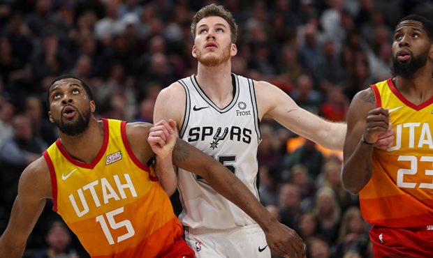 Utah Jazz forward Derrick Favors (15) and Utah Jazz forward Royce O'Neale (23) box out San Antonio ...