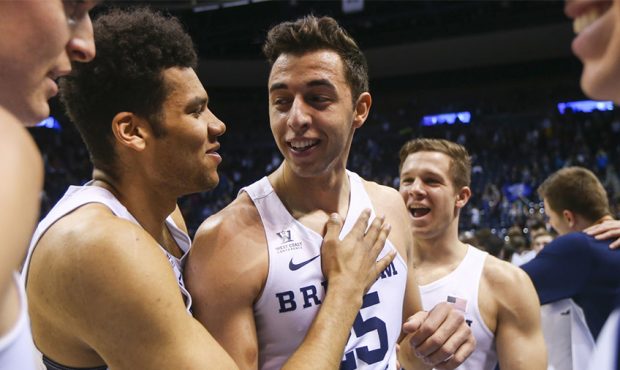 Brigham Young Cougars forward Gavin Baxter (25) in congratulated on his first double double against...