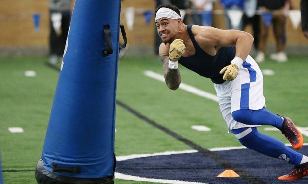 Brigham Young Cougars linebacker Sione Takitaki works out for NFL scouts during Pro Day in Provo on...