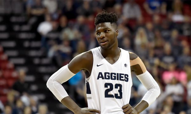 Neemias Queta #23 of the Utah State Aggies looks on against the San Diego State Aztecs during the c...