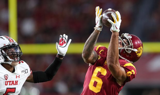 Wide receiver Michael Pittman Jr. #6 of the USC Trojans makes a catch from quarterback Matt Fink #1...