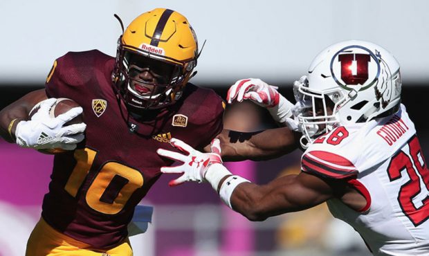 Wide receiver Kyle Williams #10 of the Arizona State Sun Devils avoids a tackle from defensive back...