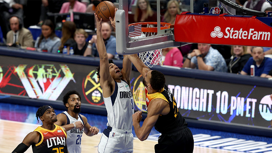 Rudy Gobert #27 of the Utah Jazz blocks a shot by Josh Green #8 of the Dallas Mavericks in the firs...