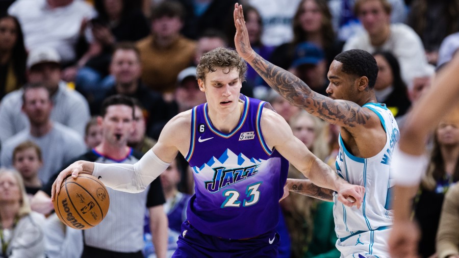 Utah Jazz forward Lauri Markkanen (23) posts up...