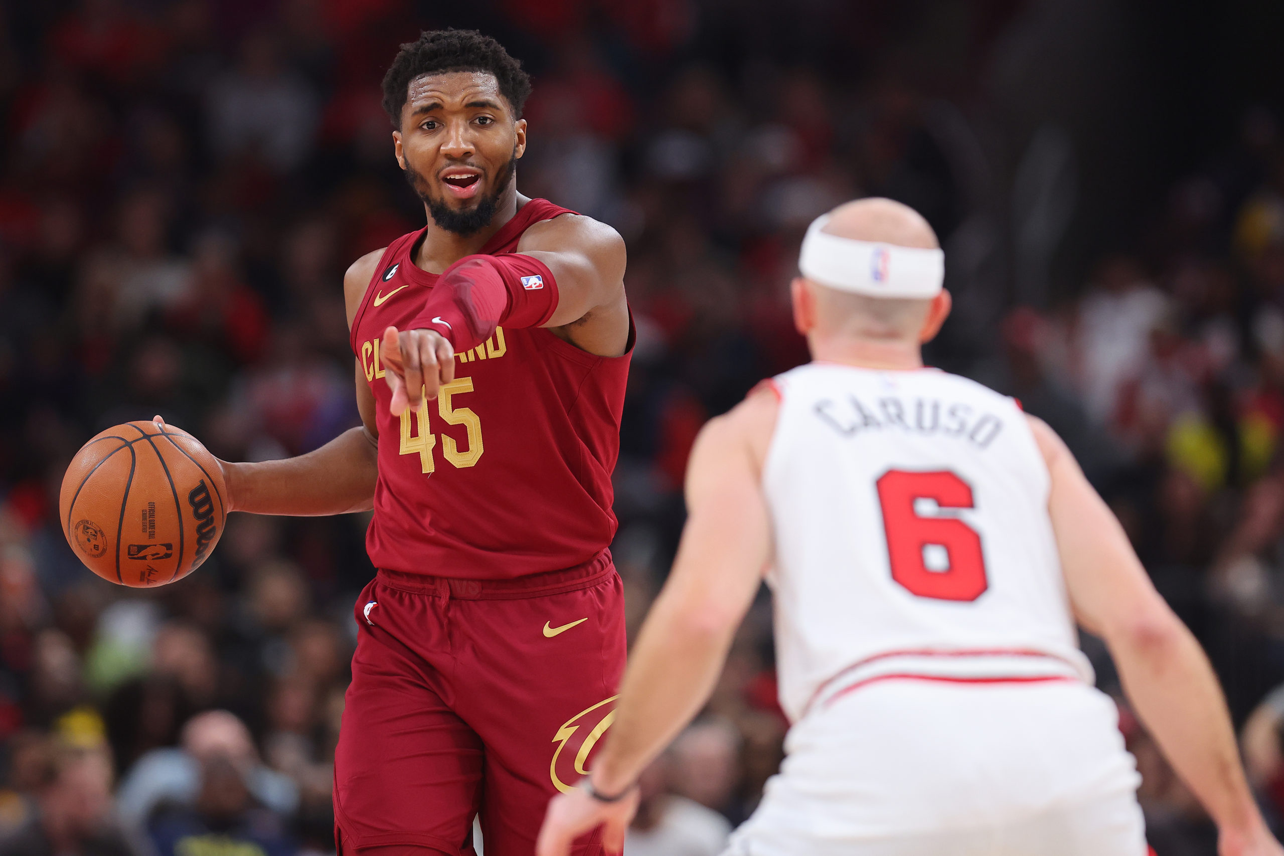 CHICAGO, ILLINOIS - DECEMBER 31: Donovan Mitchell #45 of the Cleveland Cavaliers dribbles against t...