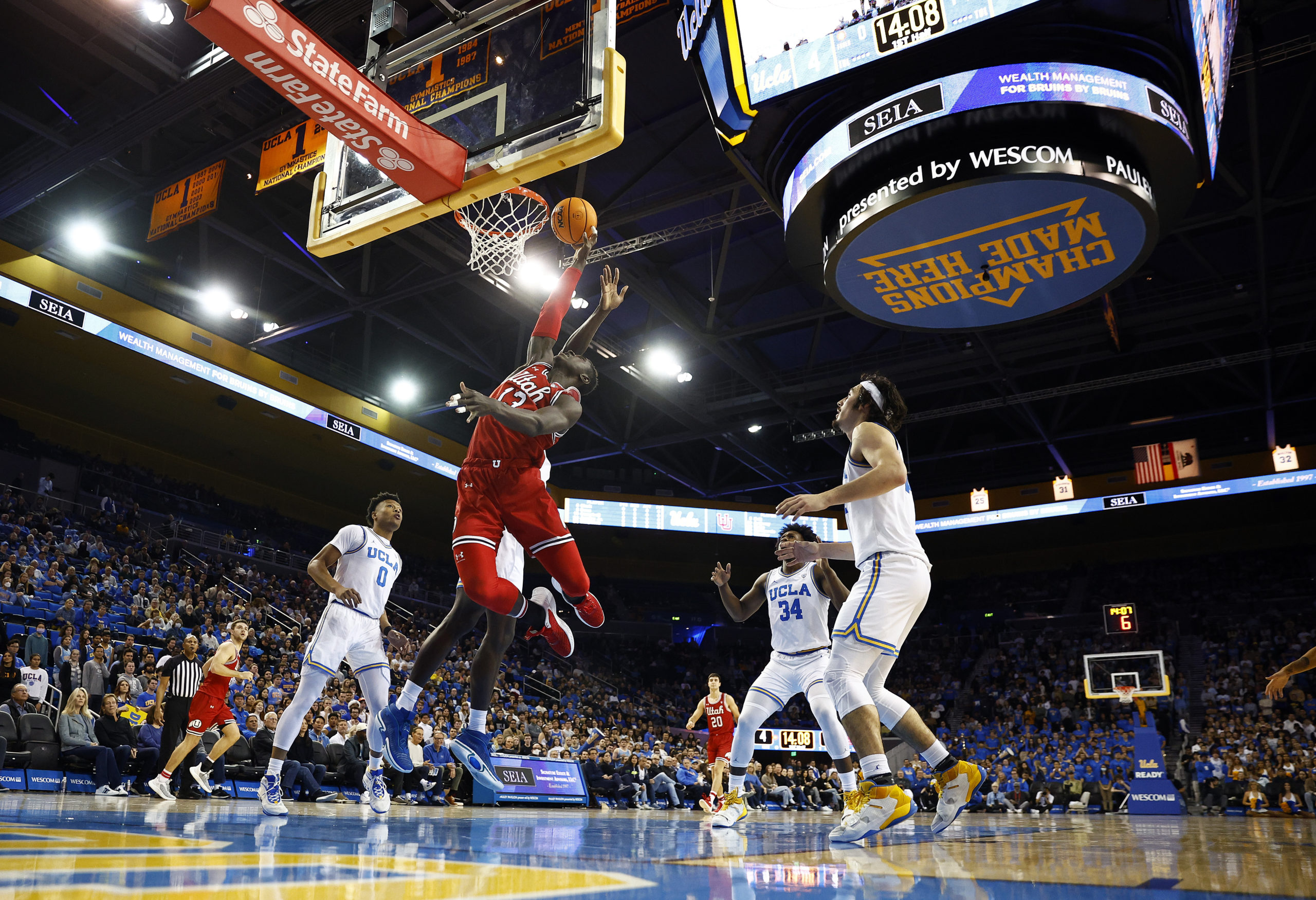 LOS ANGELES, CALIFORNIA - JANUARY 12:  Keba Keita #13 of the Utah Utes takes a shot against the UCL...