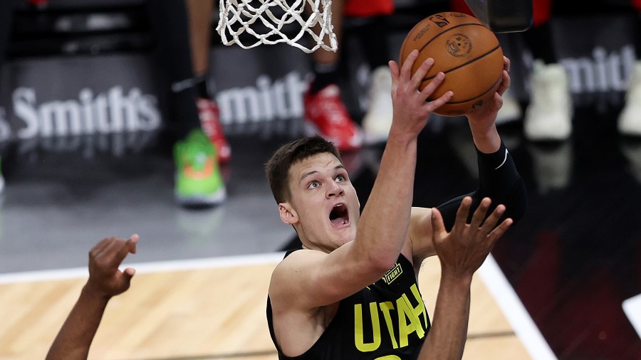 Utah Jazz Center Walker Kessler goes up for a shot...