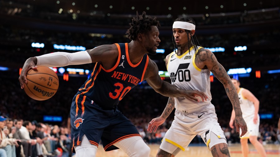 Jordan Clarkson of the Utah Jazz defends New York Knicks forward Julius Randle...