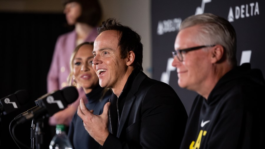 Utah Jazz owners Ashley and Ryan Smith sit with Delta CEO Ed Bastian...