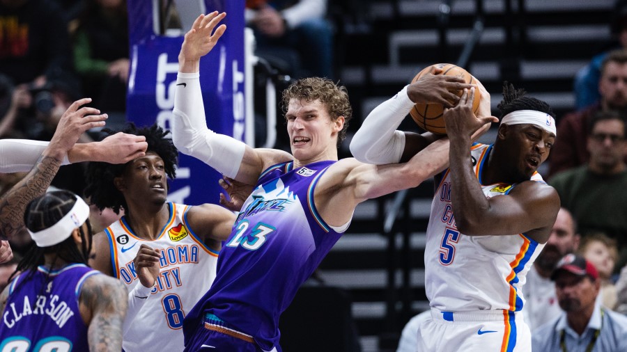 Utah Jazz forward Lauri Markkanen fights for a rebound against the Oklahoma City Thunder...