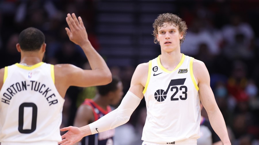 Talen Horton-Tucker high fives Utah Jazz teammate Lauri Markkanen...