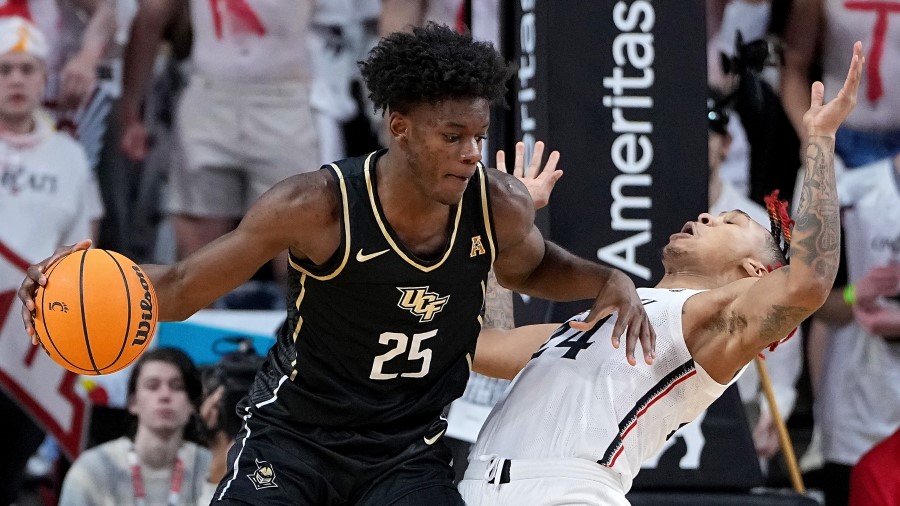 Utah Jazz - Taylor Hendricks #25 of the UCF Knights dribbles the ball....