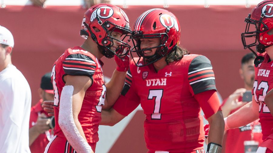 Brant Kuithe and Cameron Rising celebrate touchdown...