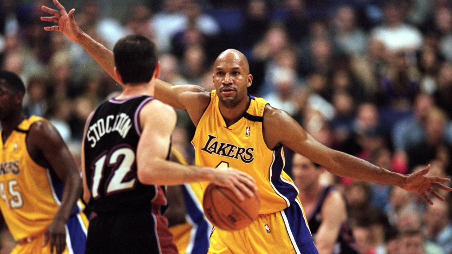 Ron Harper #4 of the Los Angeles Lakers guards John Stockton #12 of the Utah Jazz...